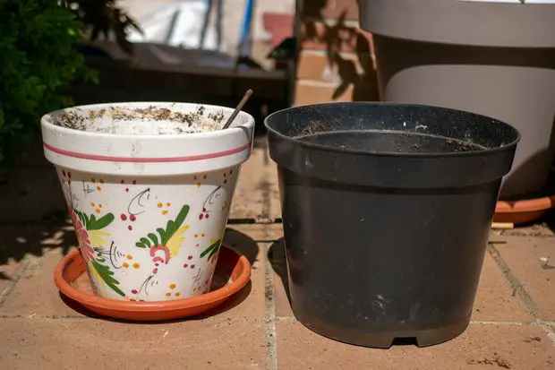 Plastic and ceramic pots are both fine. Some plastic pots might look cheap but there is no functional drawback.